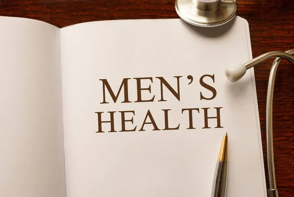 Σελίδα με την υγεία των ανδρών στο τραπέζι με στηθοσκόπιο, ιατρική έννοια — Φωτογραφία Αρχείου