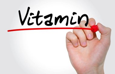 Yazıt vitamini işaretleyici ile yazma el kavramı