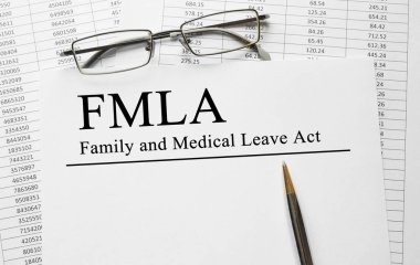 Paper with Family Medical Leave Act FMLA on a table clipart