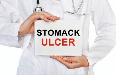 Stomack ulcer card in hands of Medical Doctor clipart