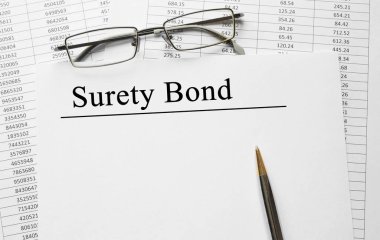 Paper with Surety Bond on a table clipart