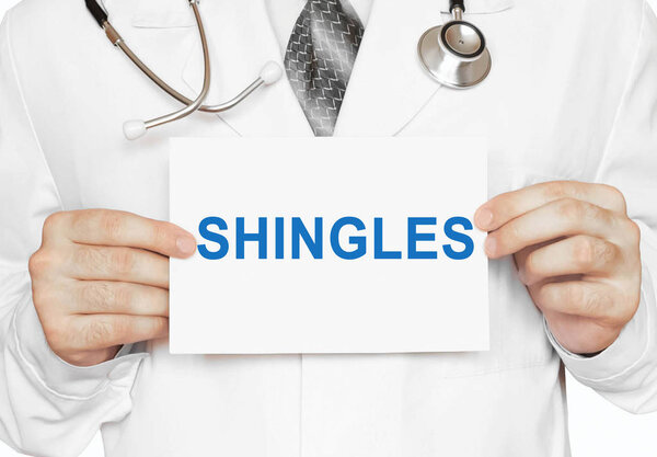 Shingles card in hands of Medical Doctor