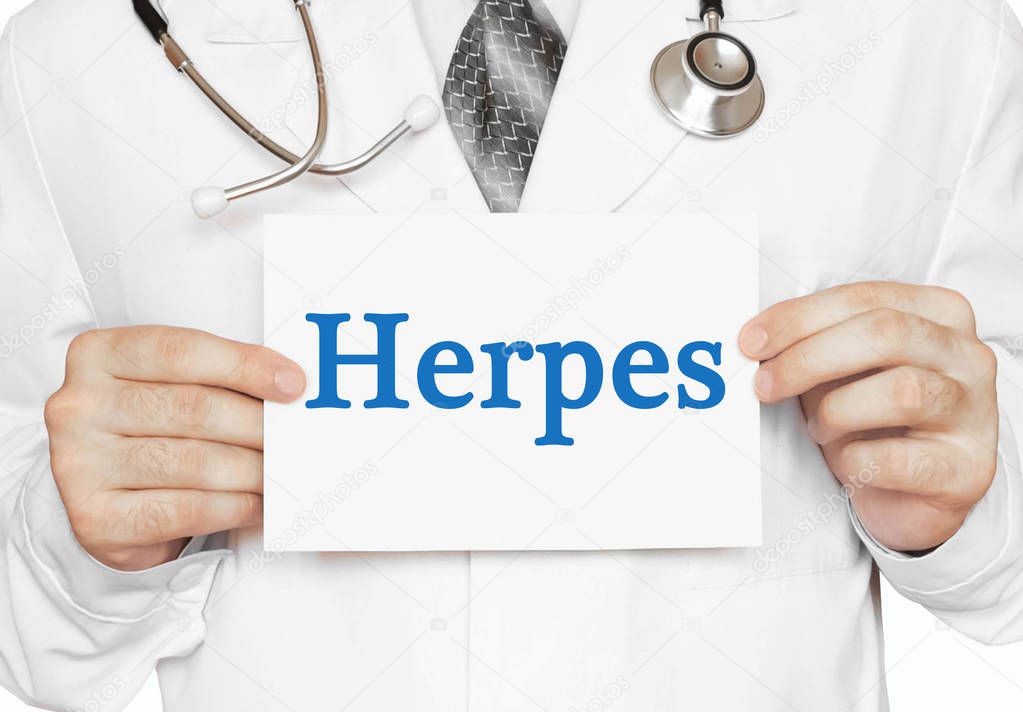 Doctor holding a card with Herpes, Medical concept