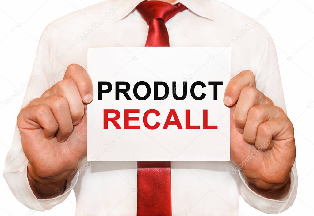 Man holding a card with a text Product Recall