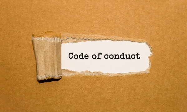 Texto Código Conduta Que Aparece Atrás Papel Castanho Rasgado — Fotografia de Stock