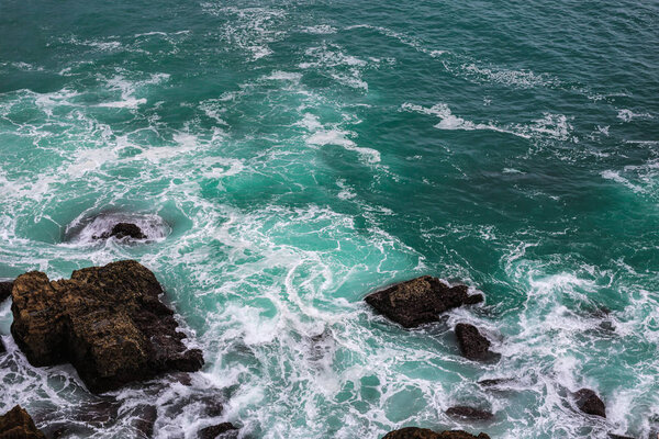 Ocean wave. High angle view to ocean waves. Blue water background.