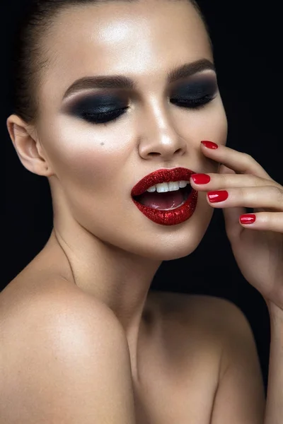 Woman with red shiny lips