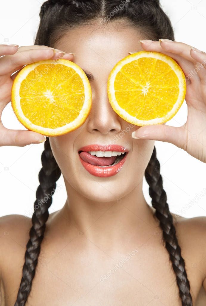 Beautiful woman with oranges