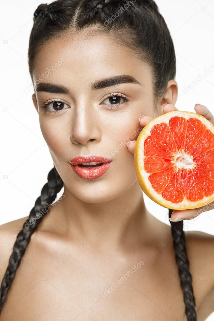 Beautiful woman with grapefruit