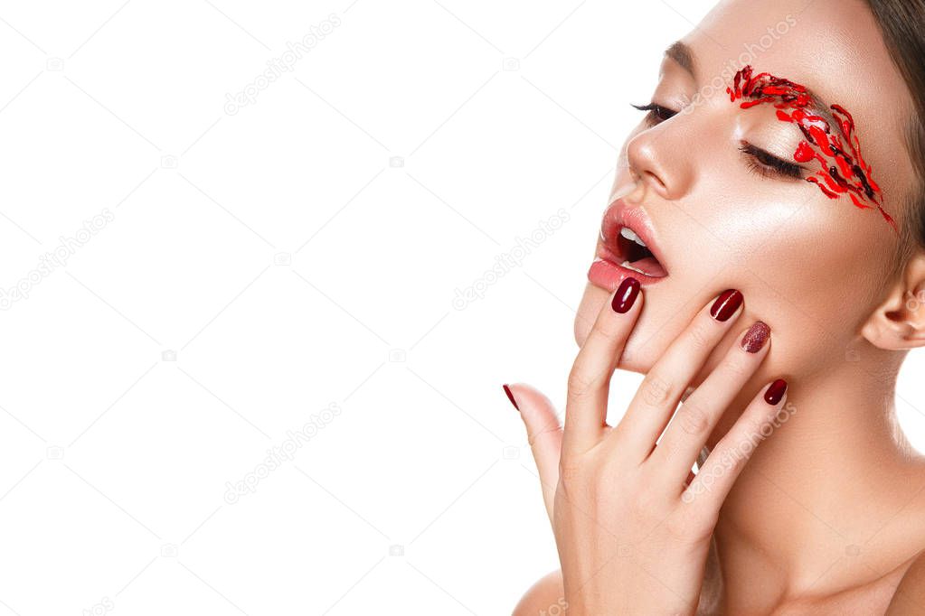 Young woman touching face