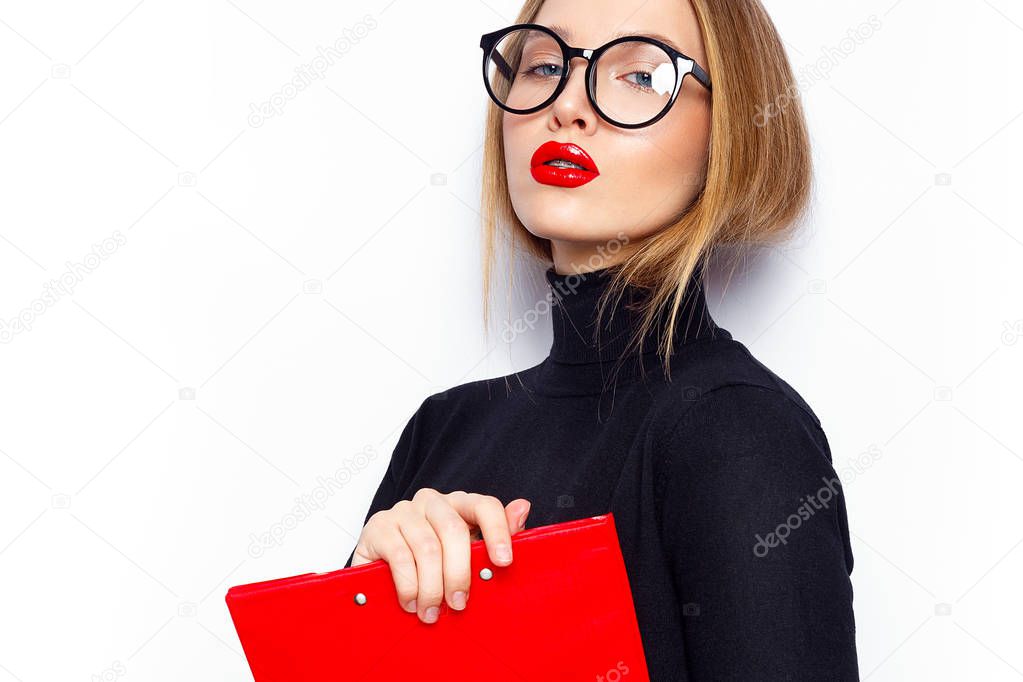 Portrait of young woman with red lips and eyeglasses posing on white background