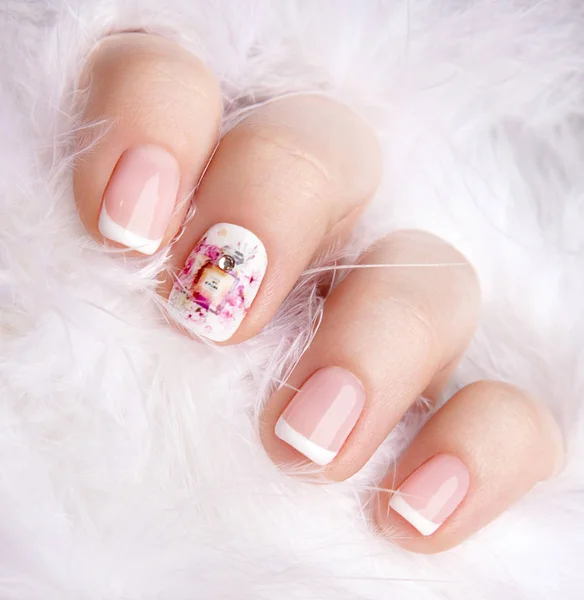 Female hand with nail art in pastel colors