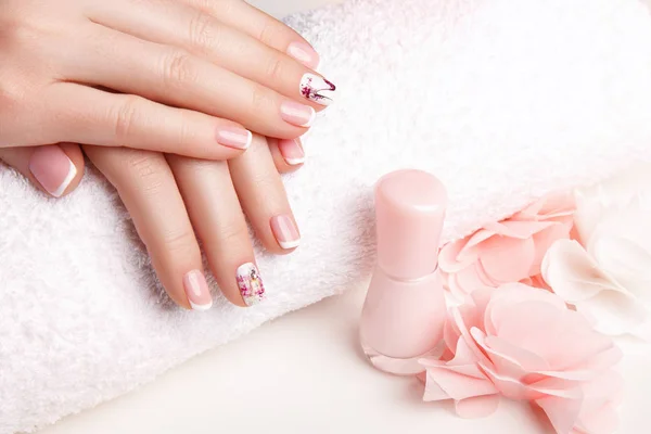 Female hands with nail art in pastel colors
