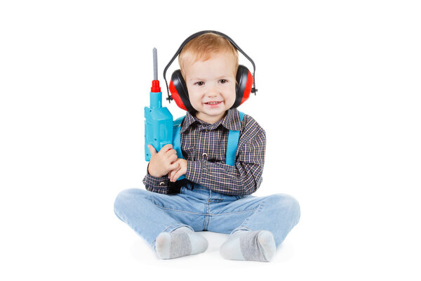 Happy little boy with tools on white background