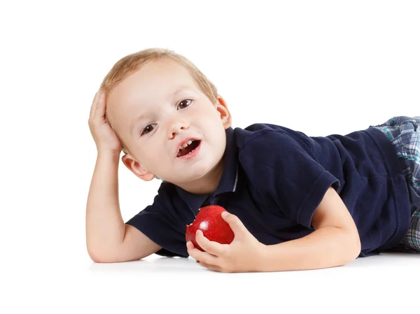 Little boy eating a red apple — Stock Photo, Image