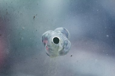 Firearms bullethole on the glass from the bullets, cracks background clipart