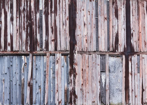 Zázemí staré dřevěné desky popraskané červenou barvou — Stock fotografie