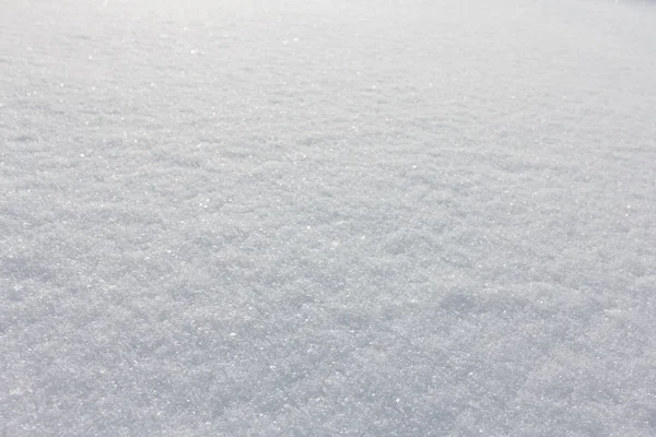 Текстура снега крупным планом — стоковое фото
