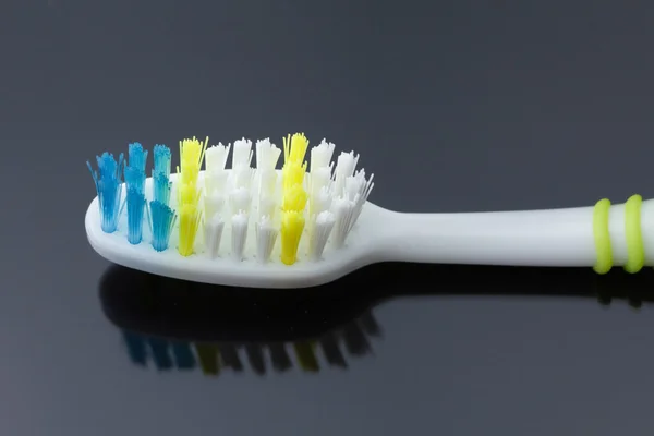 Macro shot toothbrush on black — Stock Photo, Image