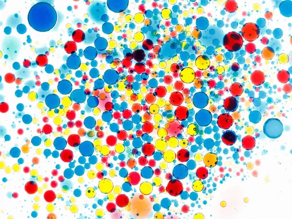Abstraktní barevné pozadí. Bubliny Malování a inkoustu na bílé, vzor kapky. — Stock fotografie