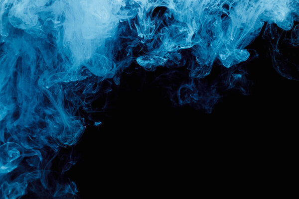 Abstract blue cloud pattern of white smoke on a black background. Waves of mist.