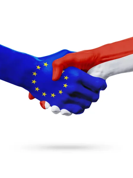 Vlaggen van de landen van de Europese Unie, Monaco, partnerschap vriendschap handdruk concept. — Stockfoto