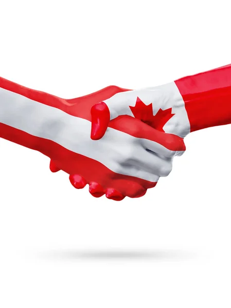 Флаги Австрия, Канада, партнерская концепция рукопожатия . — стоковое фото