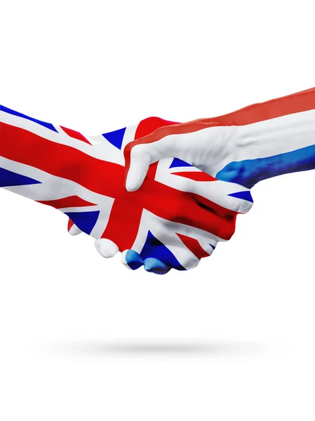 Banderas Reino Unido, Países Bajos, asociación amistad apretón de manos concepto . —  Fotos de Stock