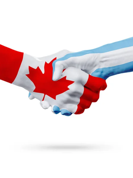 Příznaky Kanada, Argentina země, koncept partnerství handshake přátelství. — Stock fotografie