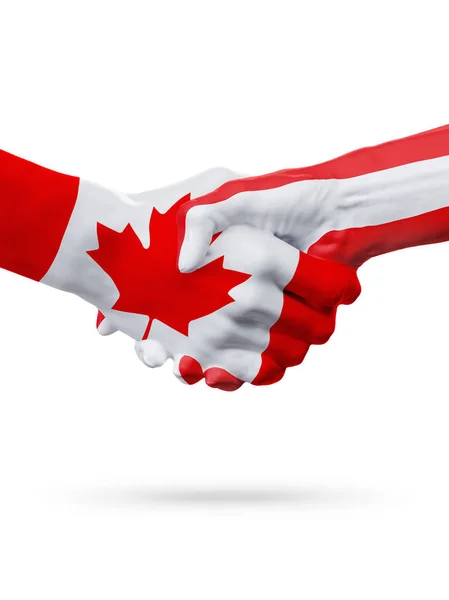 Флаги Канады, Австрии, партнерская концепция рукопожатия . — стоковое фото