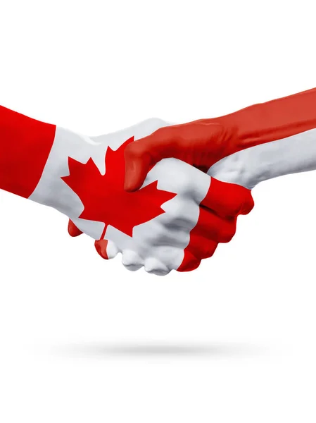 Příznaky Kanada, země Monako, koncept partnerství handshake přátelství. — Stock fotografie