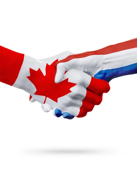 Příznaky Kanada, Nizozemsko zemí, koncept partnerství handshake přátelství. — Stock fotografie
