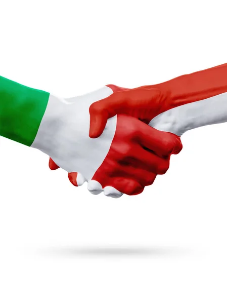Vlaggen Italië, Monaco landen, partnerschap vriendschap handdruk concept. — Stockfoto