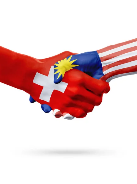 Vlaggen Zwitserland, Maleisië landen, partnerschap vriendschap handdruk concept. — Stockfoto