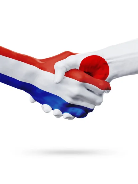 Liput Alankomaat, Japani maat, kumppanuus ystävyys kädenpuristus käsite . — kuvapankkivalokuva