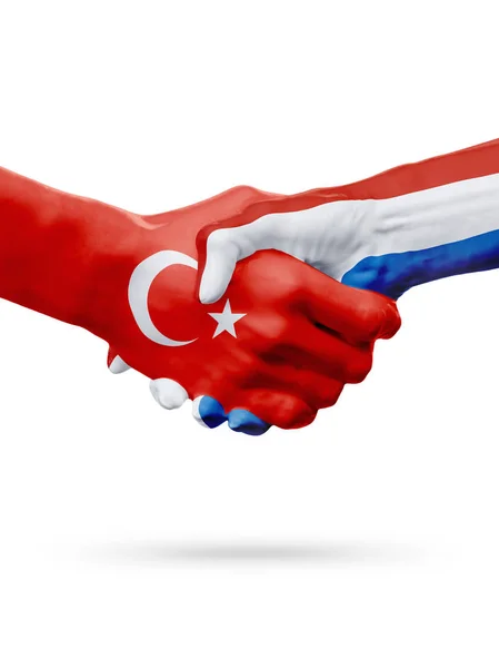 Vlaggen van de Republiek Turkije, de landen Nederland, partnerschap vriendschap handdruk concept. — Stockfoto