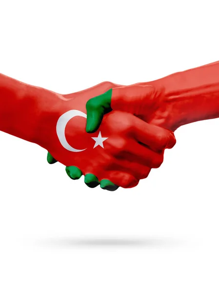 Vlaggen van de Republiek Turkije, de landen Portugal, partnerschap vriendschap handdruk concept. — Stockfoto