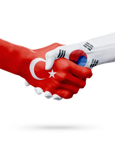 Vlaggen van de Republiek van Turkije, de landen van Zuid-Korea, partnerschap vriendschap handdruk concept. — Stockfoto