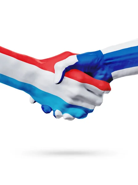 Vlaggen Luxemburg, Finland landen, partnerschap vriendschap handdruk concept. — Stockfoto