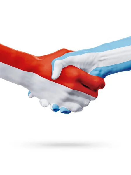 Vlaggen Monaco, Argentinië landen, partnerschap vriendschap handdruk concept. — Stockfoto