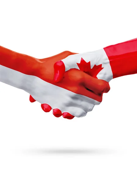 Příznaky Monako, Kanada zemí, koncept partnerství handshake přátelství. — Stock fotografie