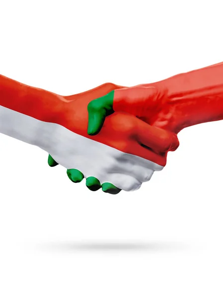 Flaggor Monaco, Portugal länder, partnerskap vänskap handslag koncept. — Stockfoto
