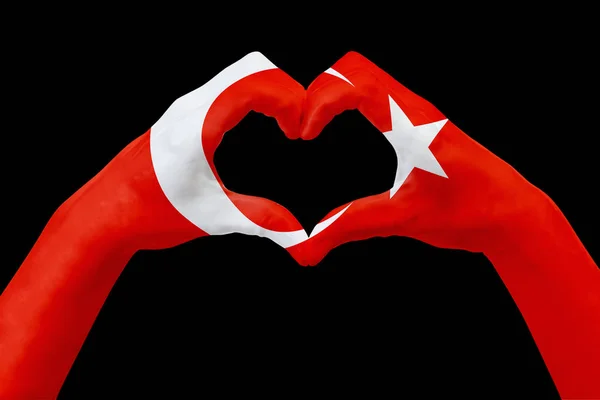 För Turkiet, flagg på händer forma ett hjärta. Begreppet land symbol, isolerade på svart. — Stockfoto