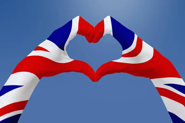 Флаг рук Великобритании, форма сердца. Понятие символа страны, на голубом небе . — стоковое фото