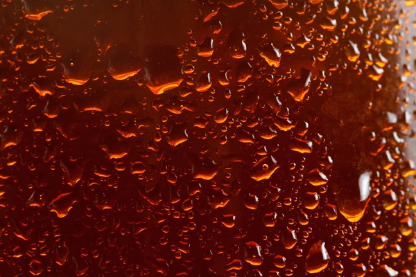 Fondo de cerveza, gotas de flujo macro en el vidrio —  Fotos de Stock