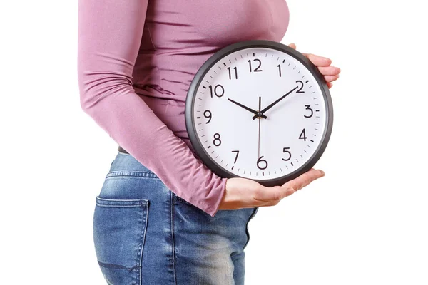 Portrait of a healthy woman holding a clock, isolated on white — Stock Photo, Image