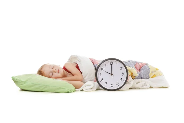 Child sleeping with alarm clock — Stock Photo, Image