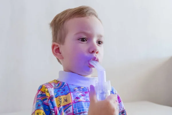 Boy therapeutic inhalation using a nebulizer