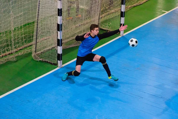Football goalkeeper on goal, field, Futsal ball field in the gym indoor, Soccer sport field — Stock Photo, Image