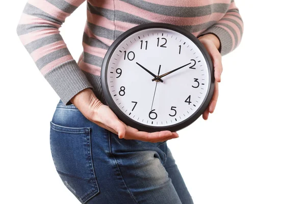 Portrait of a healthy woman holding a clock, isolated on white — Stock Photo, Image